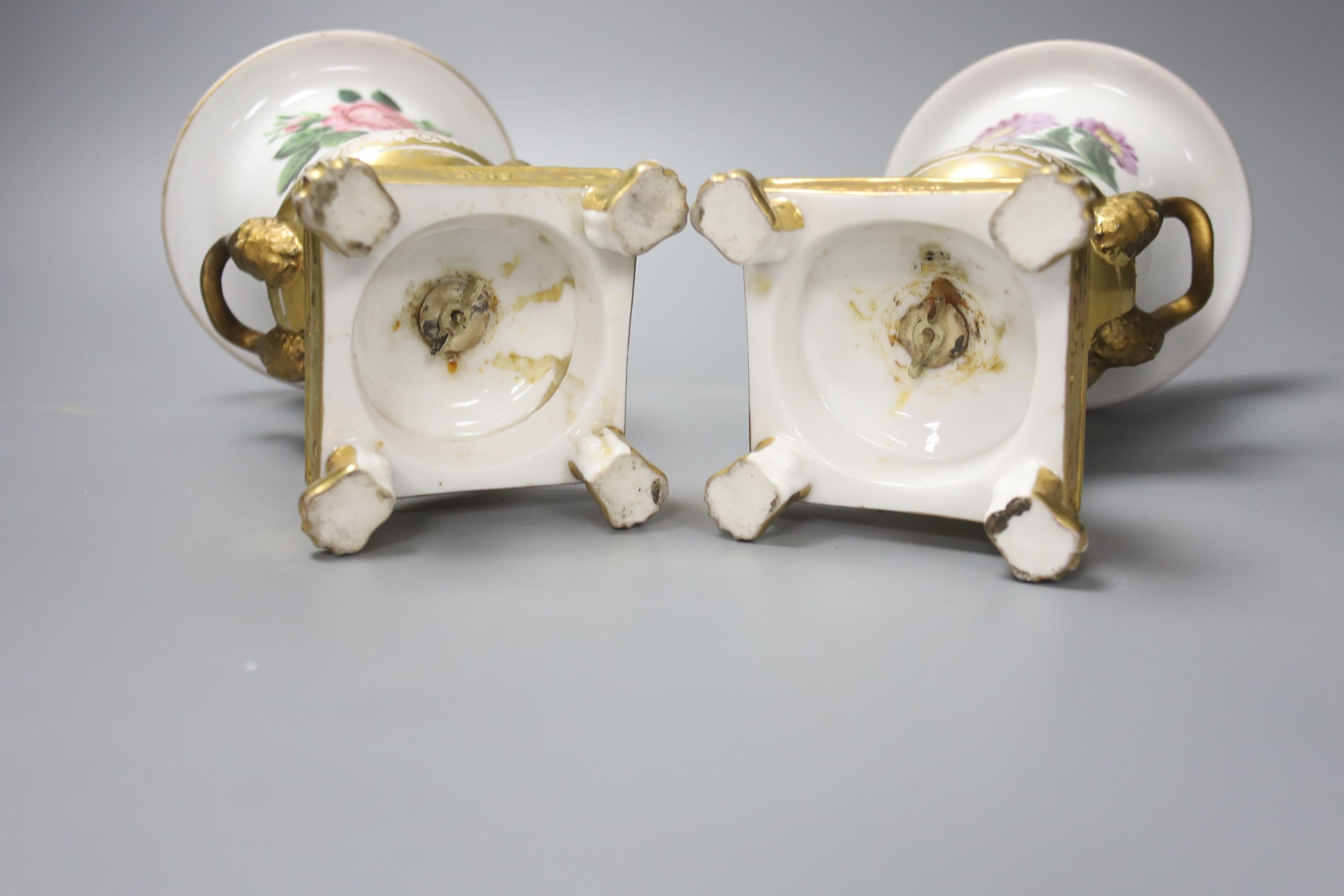 A pair of Paris porcelain flower painted campana urns, with receipt from 1928 £3.10, 20cm